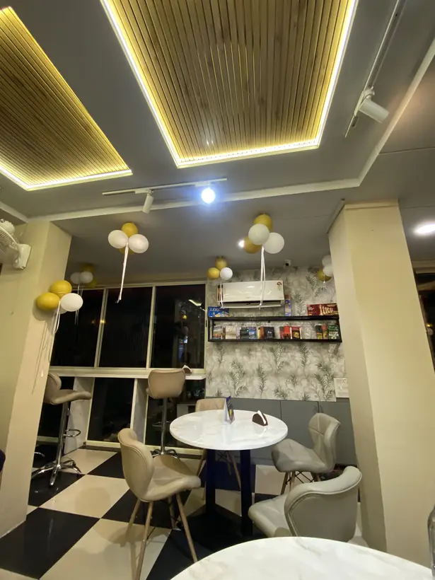 Seating with marble tables and a bookshelf